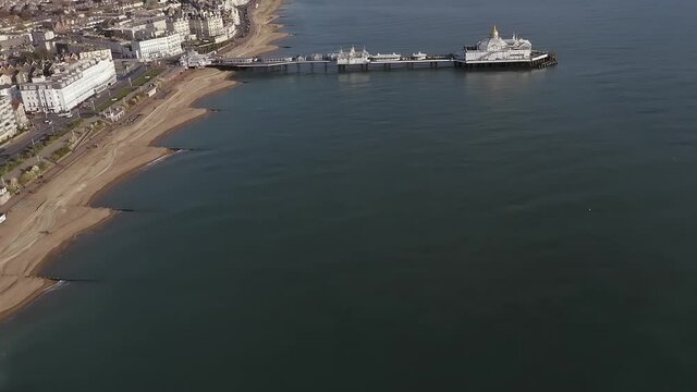Aerial Footage along Eastbourne Seafront with the Pier in view at this elegant Seafront at this popular resort town in East Sussex.