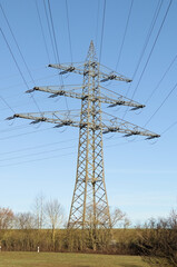 high voltage power line tower in the morning