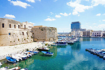 Old port of Gallipoli, view with castle and boats, Apulia, Italy