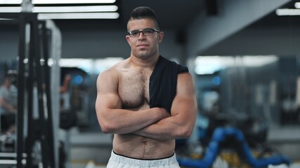 Fototapeta na wymiar Muscular Arab in the gym after a workout.