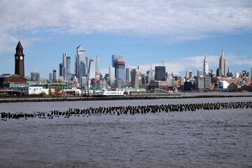 Midtown Manhattan and Hoboken train station with the Hudson river in the middle