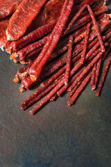 Appetizing dried sausages are many, of different sizes and shapes. Close up, top view