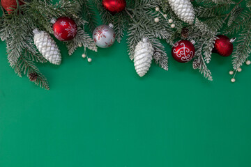 Christmas Decorations on a Green Background with Room for Copy