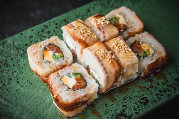 sushi on a black plate