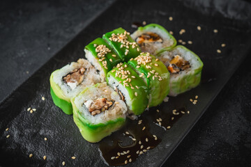 sushi on a black plate