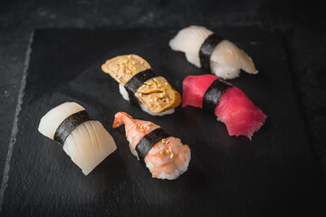 sushi on black background