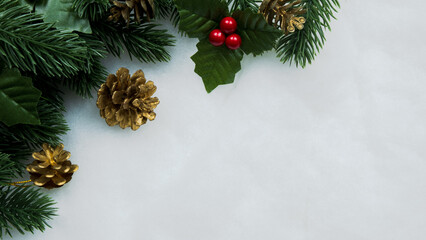 Obraz na płótnie Canvas Christmas decorations, pine tree leaves, balls, berries on snow white background, Christmas concept