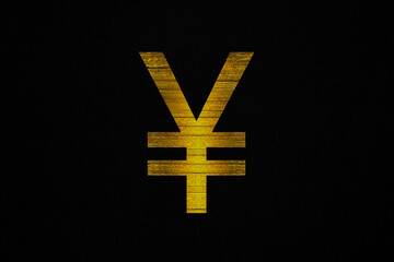 Obraz premium Golden japanese yen sign on a black canvas background