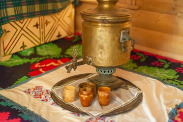 Russian samovar and a tray with cups.