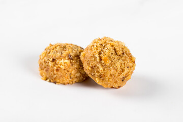 Two peanut cookies, isolated on a white background