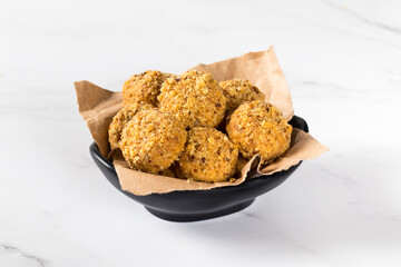 Energy peanut cookies on a serving platte on a white background