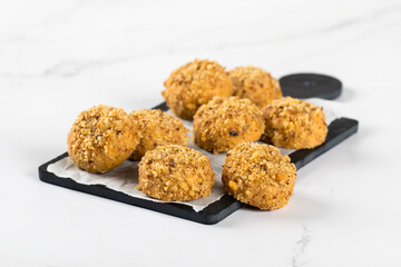 Round Peanut cookies on a serving board on a white background