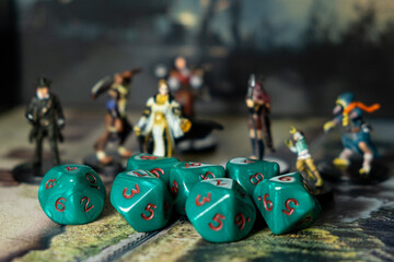 Dices for role-playing and character figures. Selective focus. Game board concept.