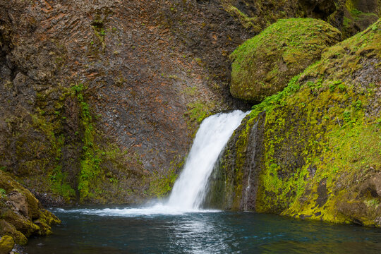 scenic waterfall in the beautiful rock formations of Thakgil canyon in Iceland