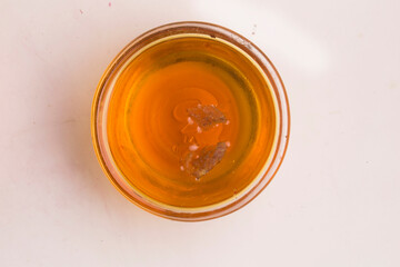 bowl of honey on grey background