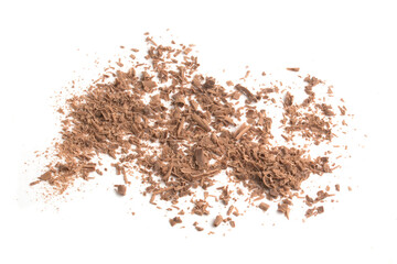 crumbs of grated chocolate on a white background