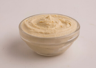 bowl with hummus on gray background