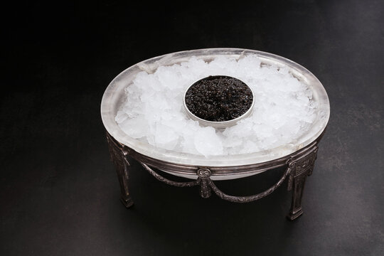 Caviar In A Metal Box Served In An Antique Caviar Set With Crushed Ice