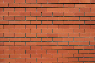 Textured background of a red brick wall