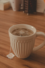 cup of hot tea on a wood desk