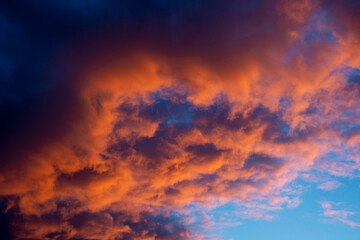 Naklejka na ściany i meble Evening sky at sunset. Blood red clouds.
