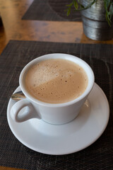 White cup of italian coffee cappuccino