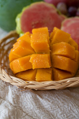 Exotic fruits of Cyprus, fresh yellow juicy mango, ripe pink guava, bananas and sweet table grapes