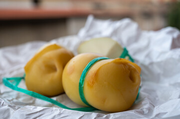 Italian cheeses collection, smoked scamorza pear shaped cheese from small cheese farm in South Italy