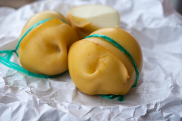 Italian cheeses collection, smoked scamorza pear shaped cheese from small cheese farm in South Italy