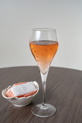 Symbols of Reims - glasses of rose brut champagne and rose biscuits