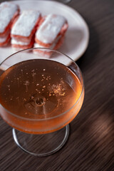 Symbols of Reims - glasses of rose brut champagne and rose biscuits