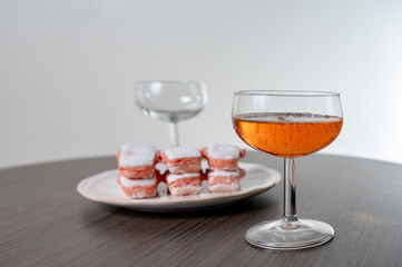 Symbols of Reims - glasses of rose brut champagne and rose biscuits