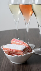 Symbols of Reims, glasses of white and rose brut champagne and rose biscuits