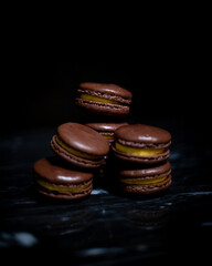 Passionfruit Macarons on Black Marble