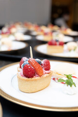 Strawberry tart and vanilla ice cream look delicious
