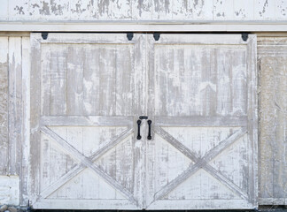 Sliding rustic barn or stable doors. White barn wood with rustic finish. - 469822318