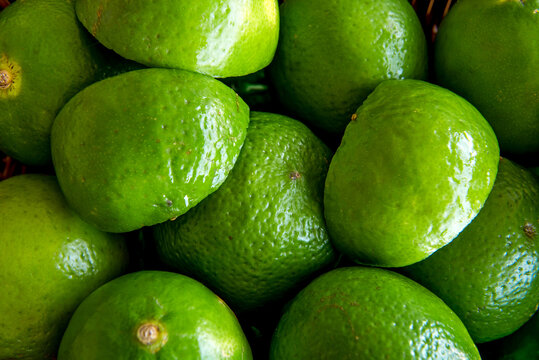 Green lemons texture background.