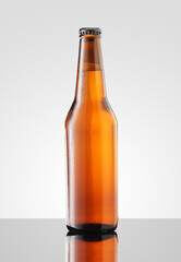 brown bottle with beer