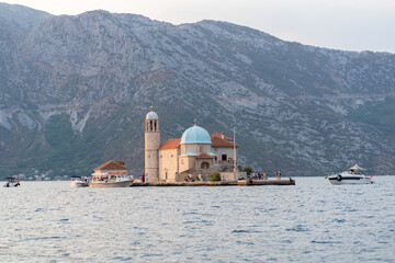 Fototapeta na wymiar Popiersie Frano Alfirević - one of the islands in the Bay of Kotor, located opposite the town of Perast Montenegro Two small islands are symbols and main attractions of the Bay of Kotor 