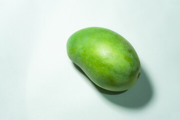 Delicious green mango fruit isolated on a white background