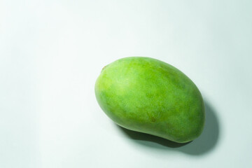 Delicious green mango fruit isolated on a white background