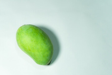 Delicious green mango fruit isolated on a white background