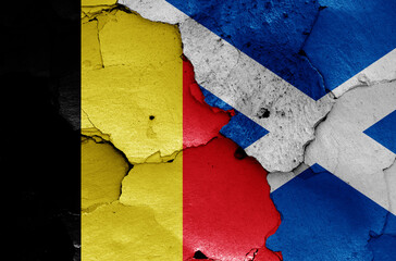 flags of Belgium and Scotland  painted on cracked wall