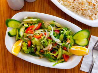 Colorful Shepherds Salad or Choban salad from fresh vegetables with dressing of lemon juice and olive oil. Azerbaijani cuisine