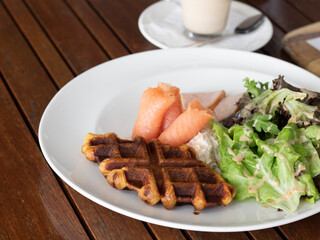 Waffle with Smoked Salmon and Salad.