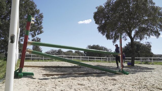 Horse running out to the left to avoid jumping the obstacle. Training fro show jumping