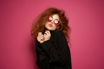 cheerful woman fashionable hairstyle sunglasses posing pink background