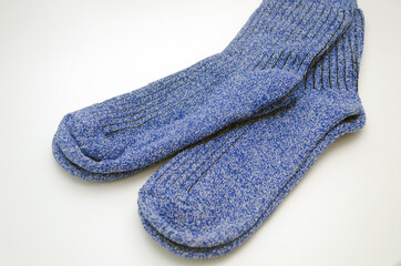 warm blue socks on a white background