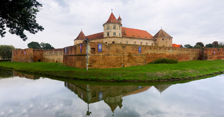 Naklejka premium Castle on the lake is landmark of Fagaras in Romania.