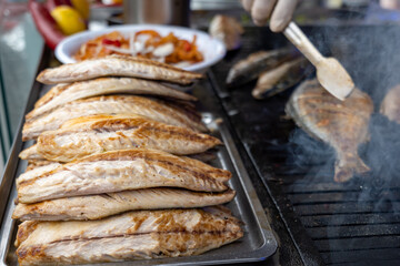 Grilled fish in Istanbul. Grilled mackerel for the popular street food in Turkey, Balik Ekmek, a Turkish fish sandwitch.